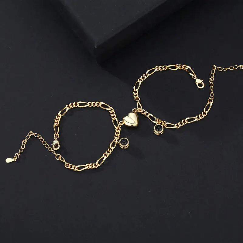 Elegant gold Couple Bracelet arrangement from My Store, featuring heart shapes and the unique 'I love you' projection.