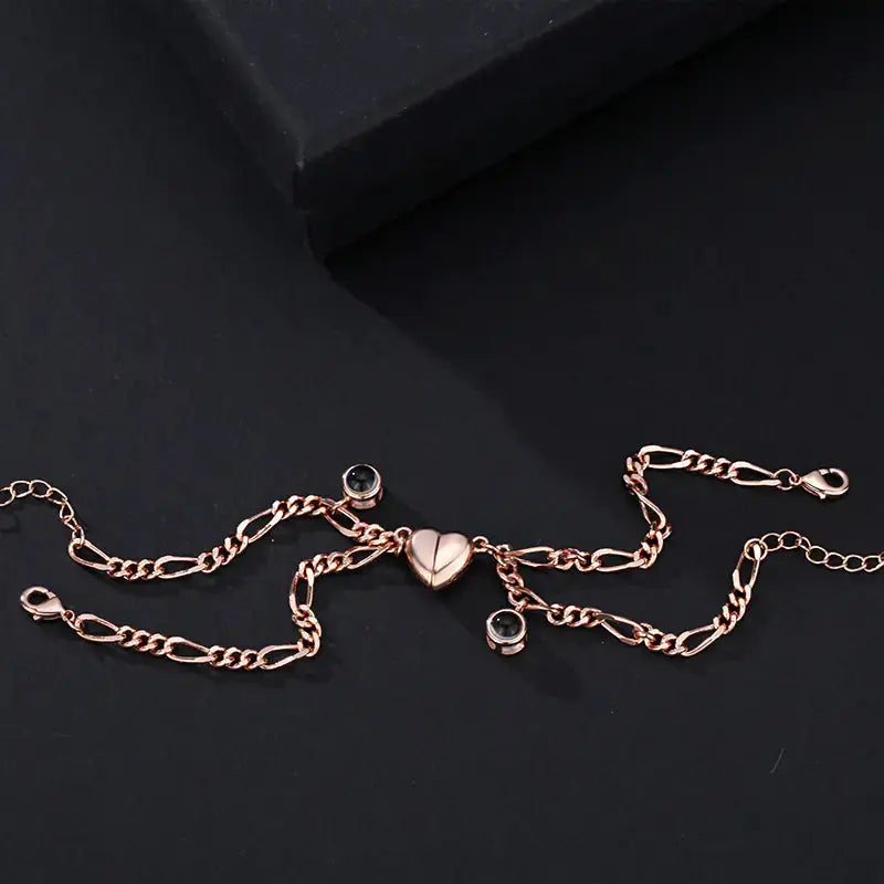 Elegant rose gold couple bracelet featuring a heart charm, designed by My Store. Perfect for expressing love with the projection of 'I love you' in 100 languages.