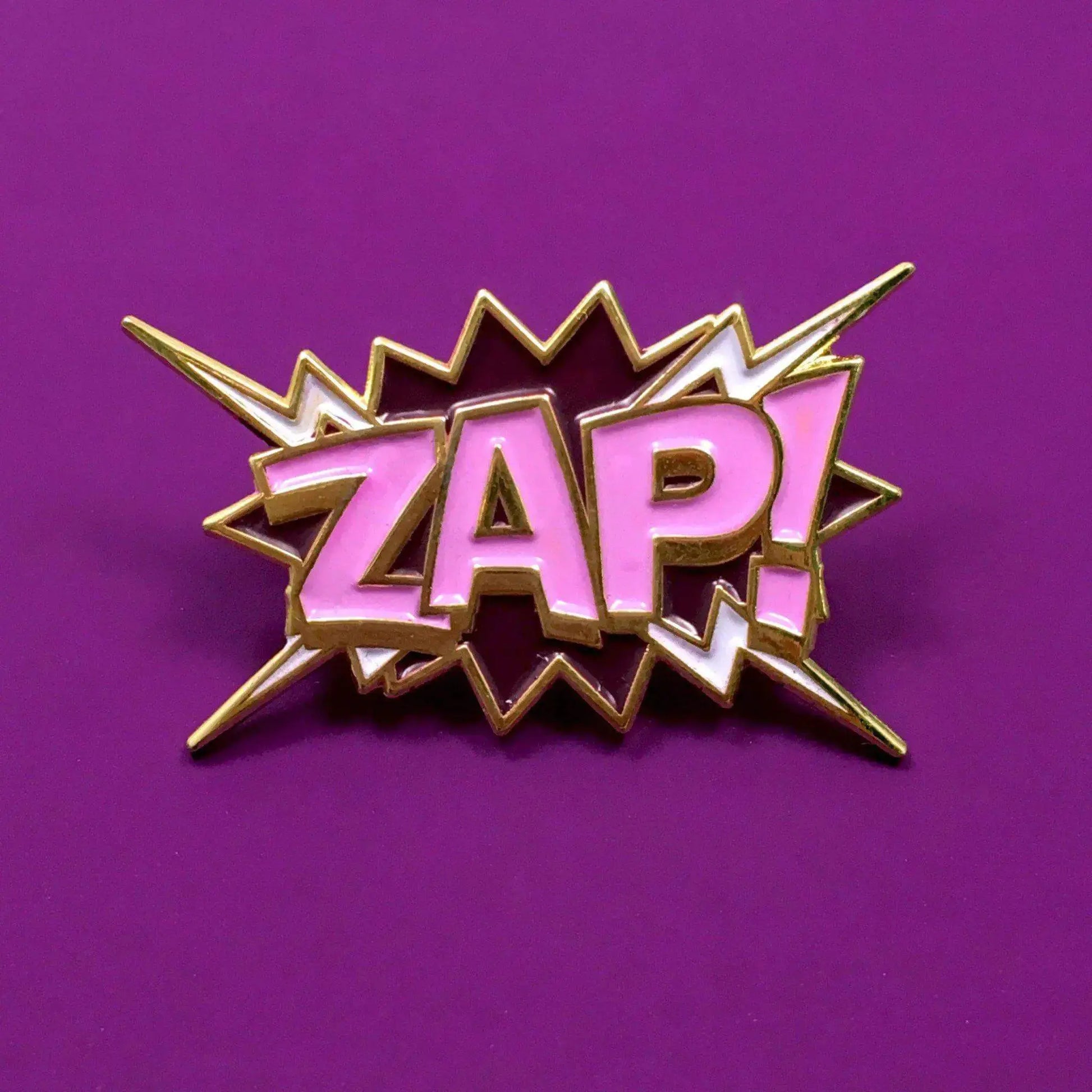 ZAP! Pop Art Pin by My Store displayed on a vibrant purple background, featuring comic book style design with the word 'ZAP!' in pink.
